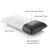 The Malouf Zoned Dough + Bamboo Charcoal pillow features a patterned white Tencel cover, with a cutaway revealing its black, perforated foam. Labels highlight the Shoulder Zone Dough design for side sleepers and bamboo charcoal infusion. Brand: Malouf.